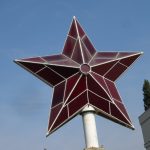 Red star that previously stood atop communist party headquarters